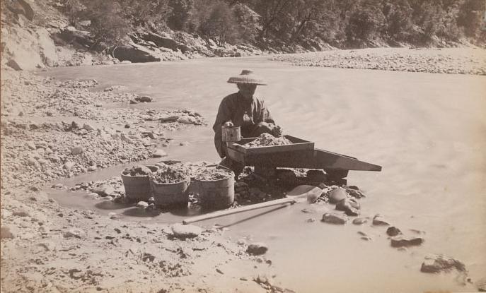 Chinese-man-mining-along-a-river